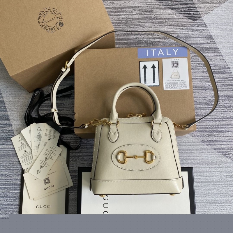 G*u*i top handle bags